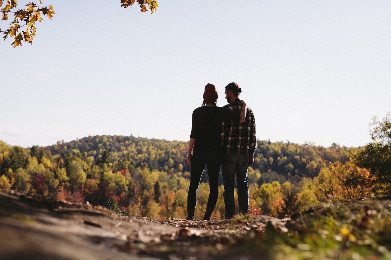 Couple hiking in the mountains in the fall